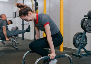 People exercising in a fitness studio run with WellnessLiving's software.