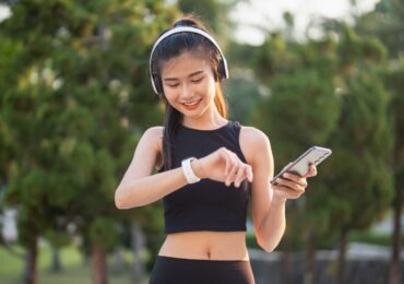 Someone getting a notification about their Yoga class while they're on the go.