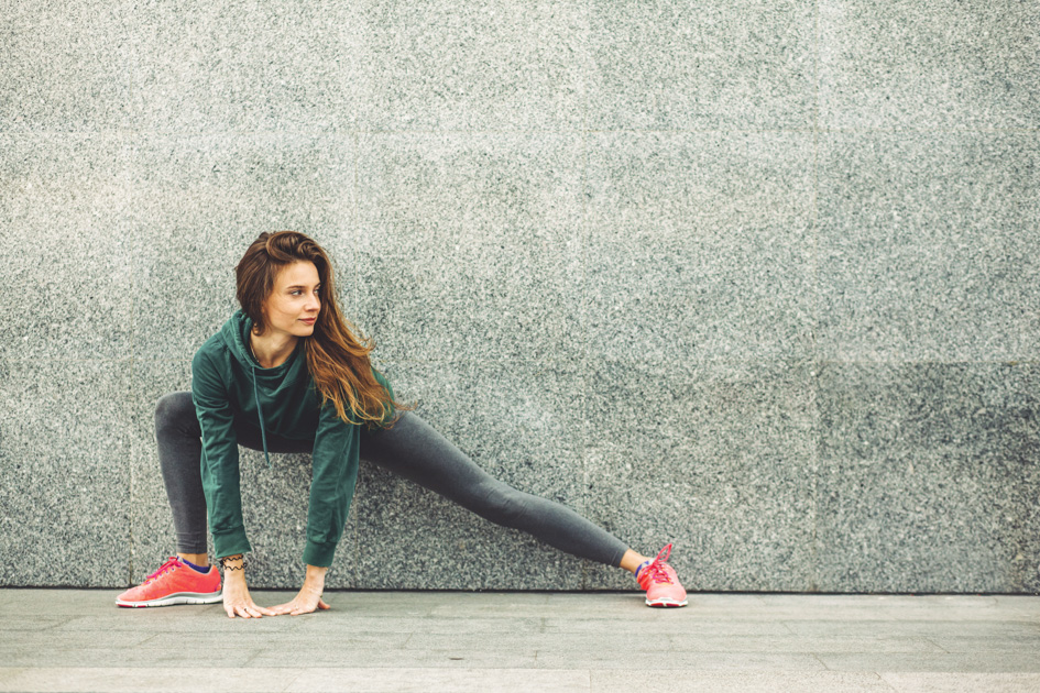 2019 fitness trends, woman stretching after a work out