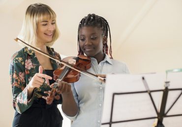 grow your music business, violin instructor and student