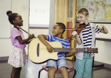 loyalty rewards program, smiling kids playing music