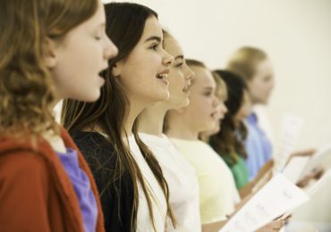 customer retention, Group Of School Children Singing