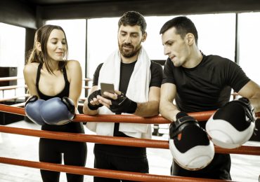 martial arts social media marketing, three boxers on phone