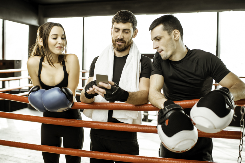 martial arts social media marketing, three boxers on phone