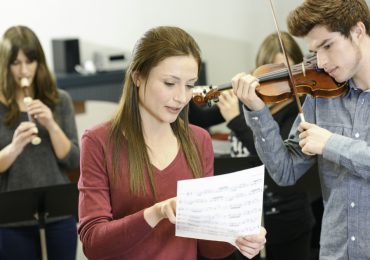 misconceptions about learning music, instructor teaching adult music student