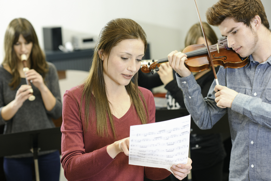 misconceptions about learning music, instructor teaching adult music student