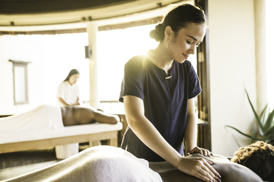 wellness center management software, Massage therapist at a spa