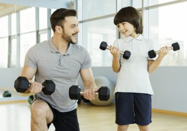 gym for children, young boy and personal trainer