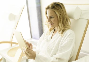 wellness center social media, woman checking phone
