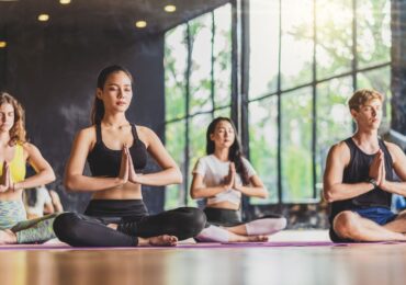 A popular yoga studio, hosting a New Year's meditation class.