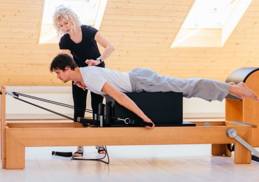 Pilates instructor, Pilates instructor with client