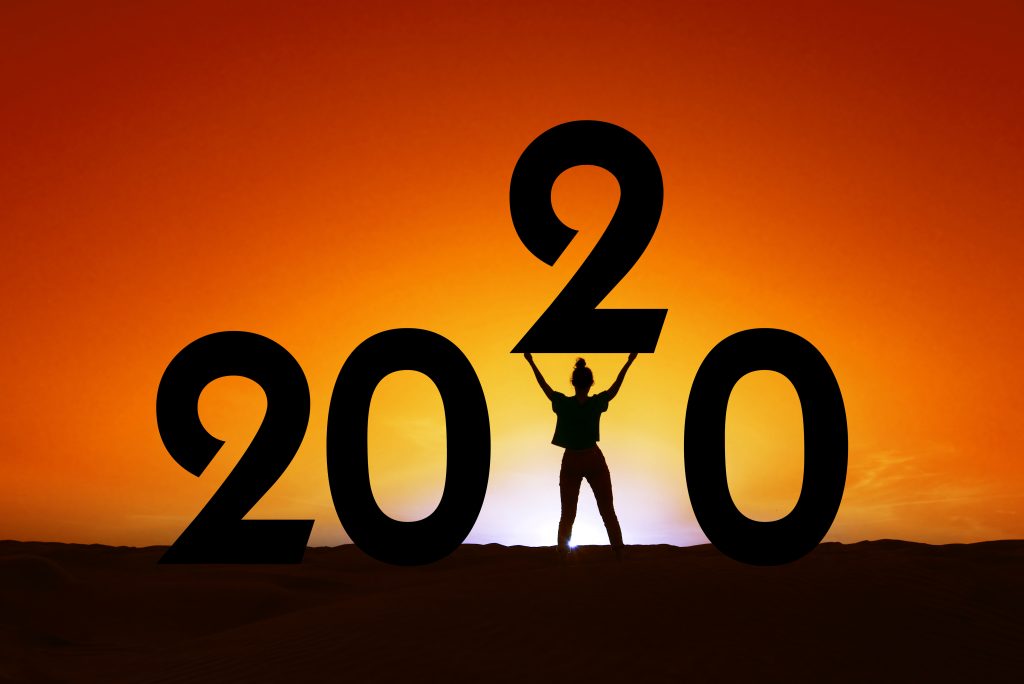 new year marketing strategy, 2020, silhouette of a woman standing in the sunset,