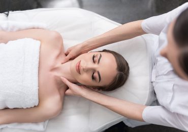 how to attract more clients to your wellness center, woman enjoying massage