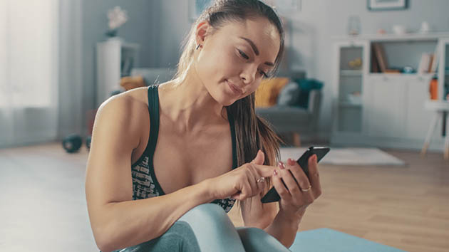 market your business, fitness woman on phone