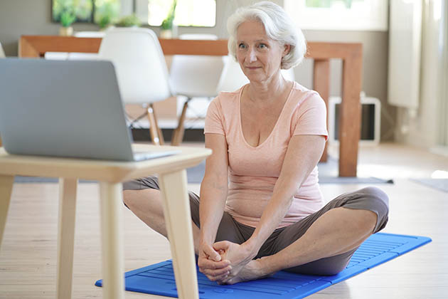 online services, senior woman doing fitness at home