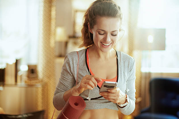 widgets, sporty woman using smartphone