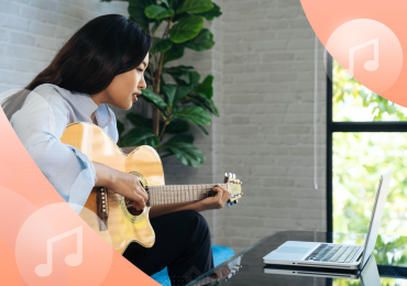 music school, girl with a guitar and a computer