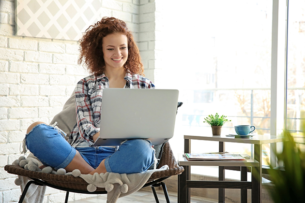 rebrand your fitness business, beautiful young woman using laptop at home