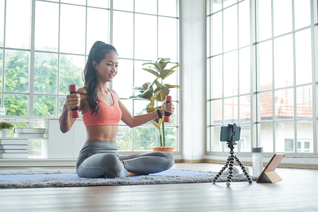 Zoom integration, woman exercise with dumbbell