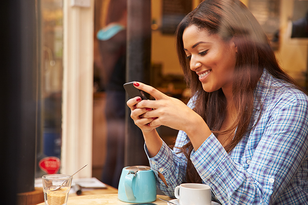 automated notifications, woman using her mobile phone