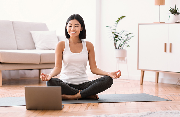 automated notifications, millennial woman meditating with trainer online on laptop