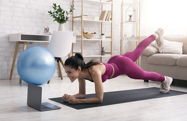 multiple closures, beautiful girl participating in online fitness class via laptop at home