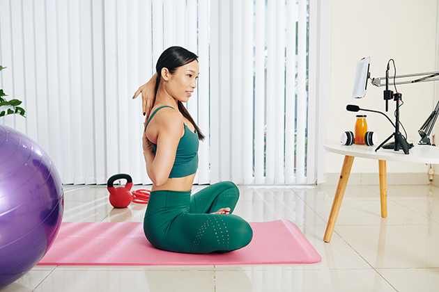 virtual content, woman conducting online yoga class