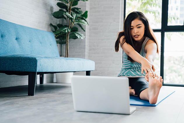 KPIs, Asian woman in sportswear doing stretching exercises