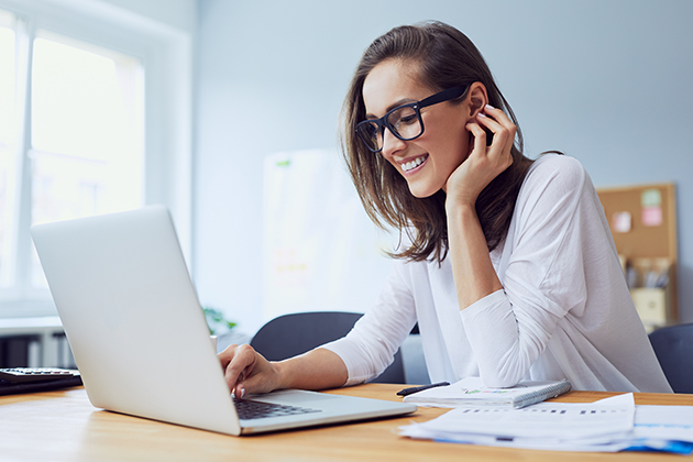 business advisor, beautiful cheerful young businesswoman working on laptop and laughing in home office