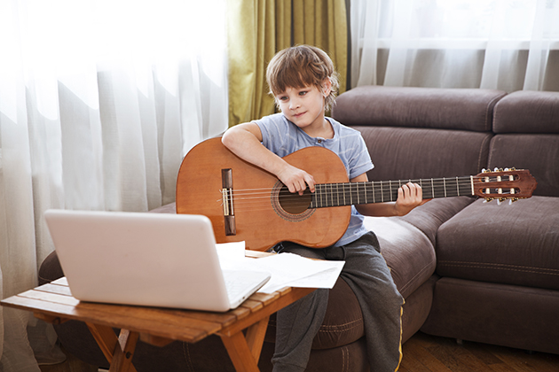 music school, boy taking an online music class