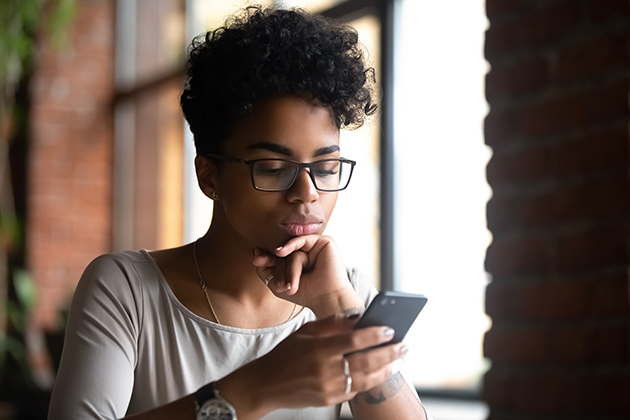 music school, woman surfing internet using phone