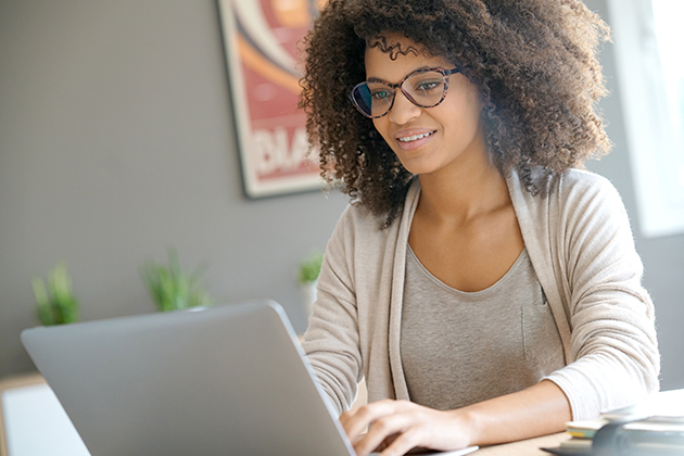 increasing revenue, woman working from home on laptop computer