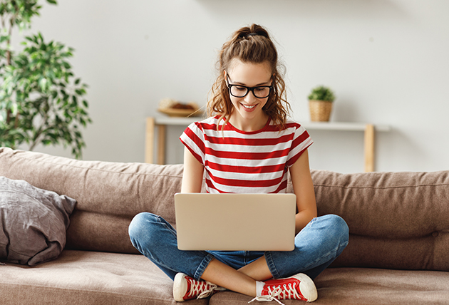 automated chatbots, joyful relaxed woman using laptop at home