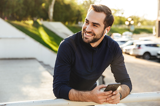 fitness culture, happy man on his phone