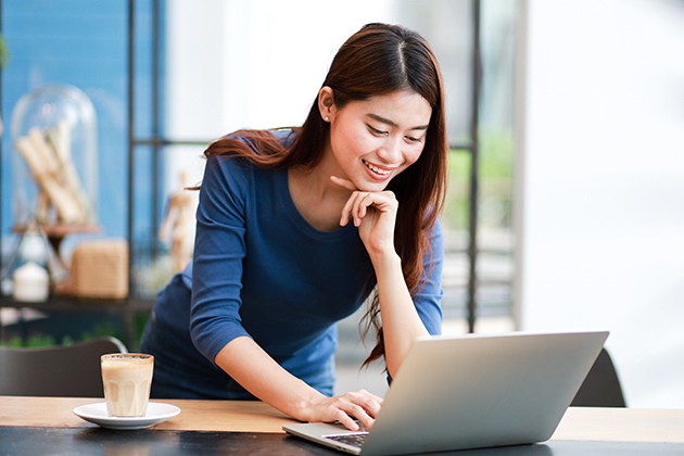 manage your dance studio staff, Asian woman at her computer