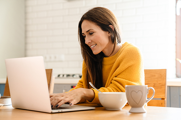 fitness email newsletter, woman at her computer