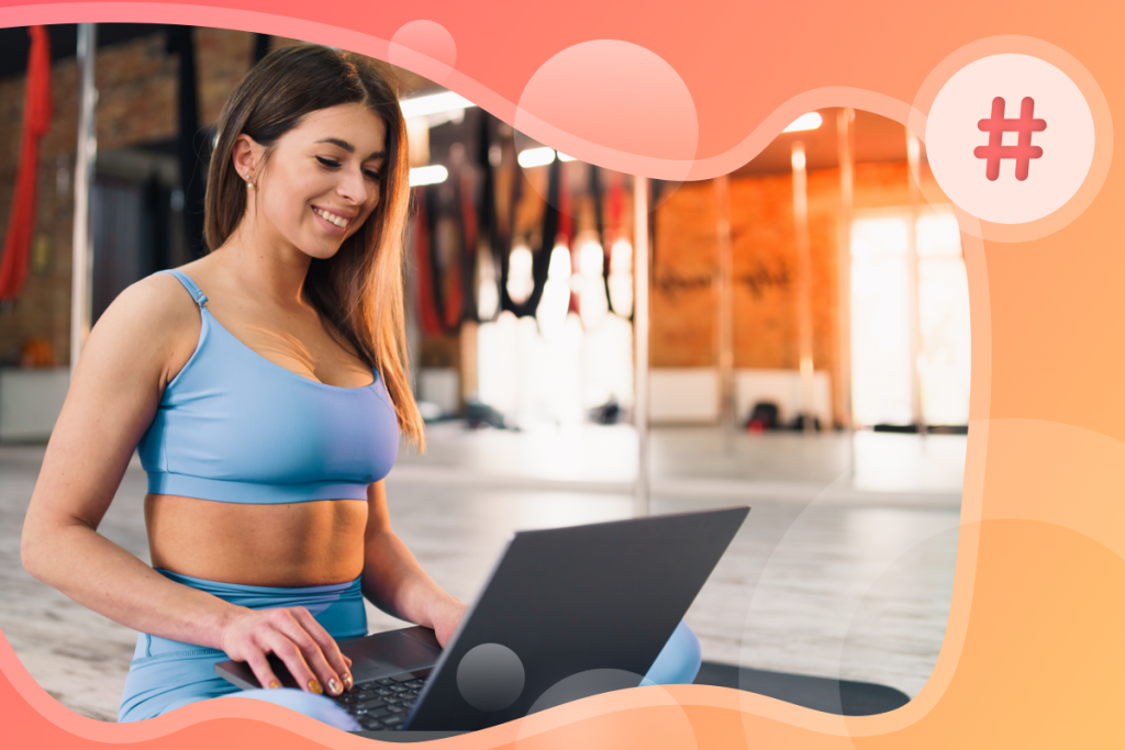 attract new members to your fitness business, woman at her computer