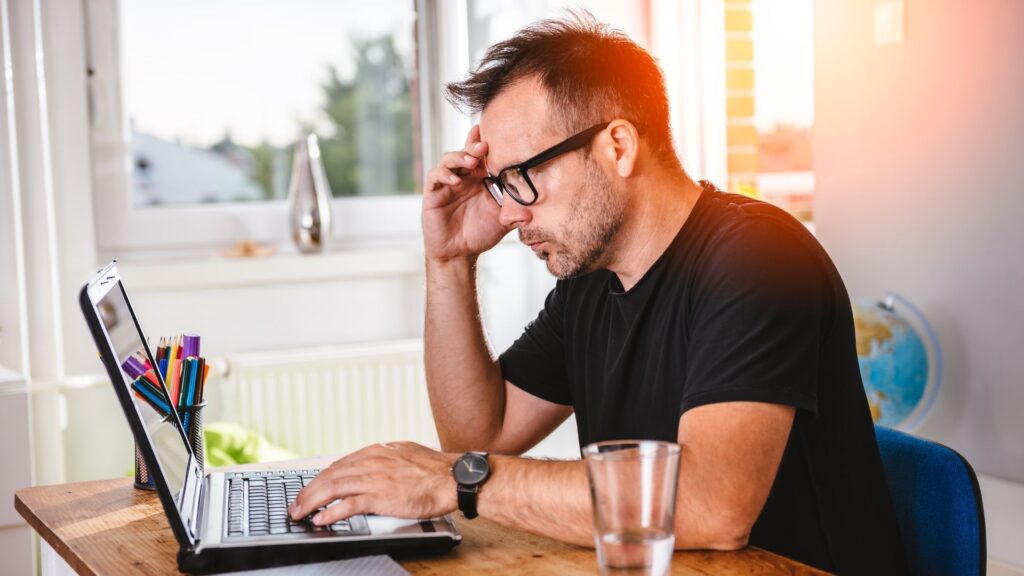 A small business owner working on the web design for his small business.