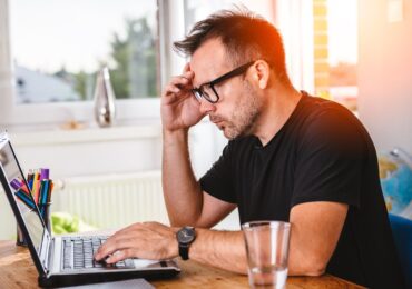 A small business owner working on the web design for his small business.