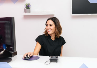 Jane App Alternatives, woman on a computer