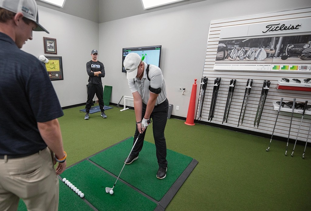 Man putting at Altura Golf Lab