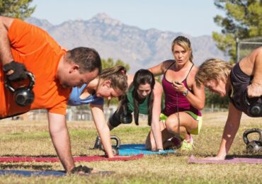 A popular fitness bootcamp trains while while coach times them.