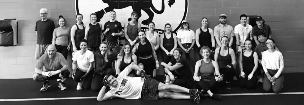 A black and white photo of the Griffins Boxing team.