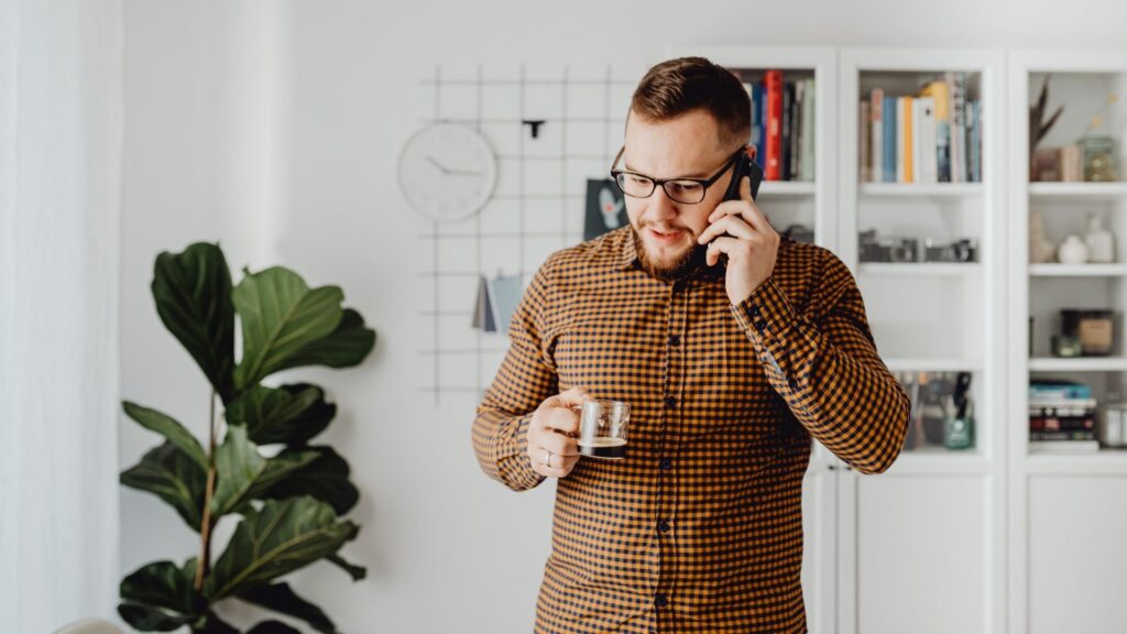 A man scheduling a dental appointment over the phone with the virtual assistant CASSI.