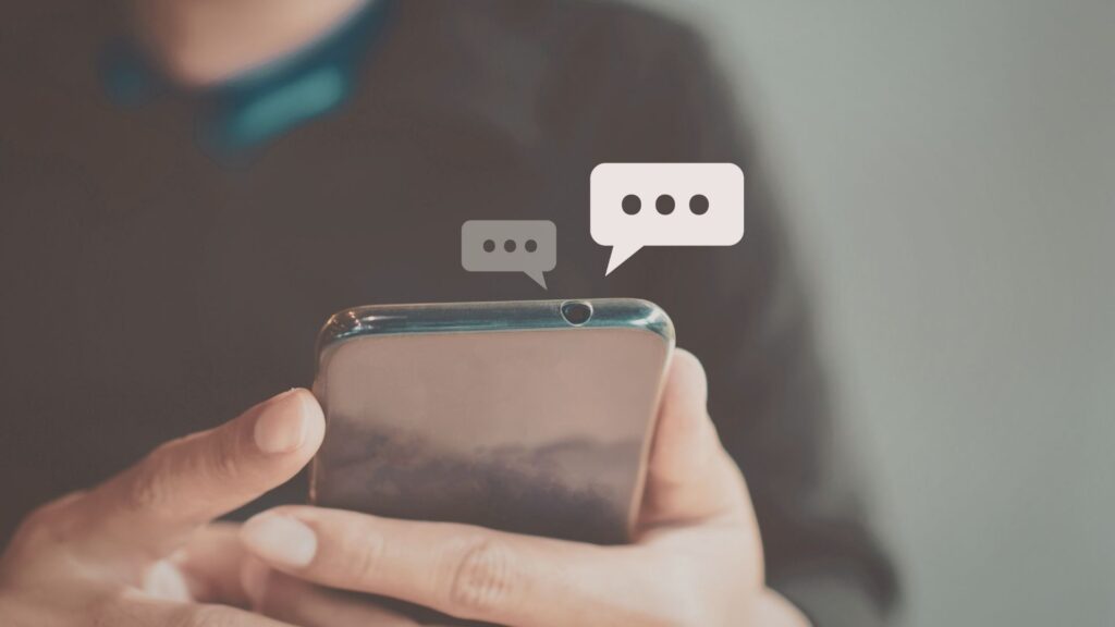 Someone using an AI chatbot on their phone, to connect to their wellness center.