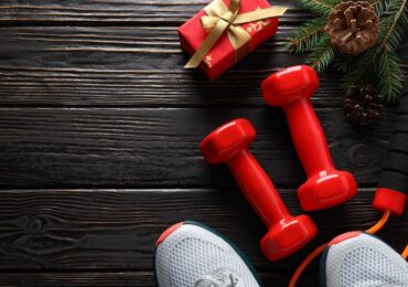 A photo of a holiday present and some festive workout gear.