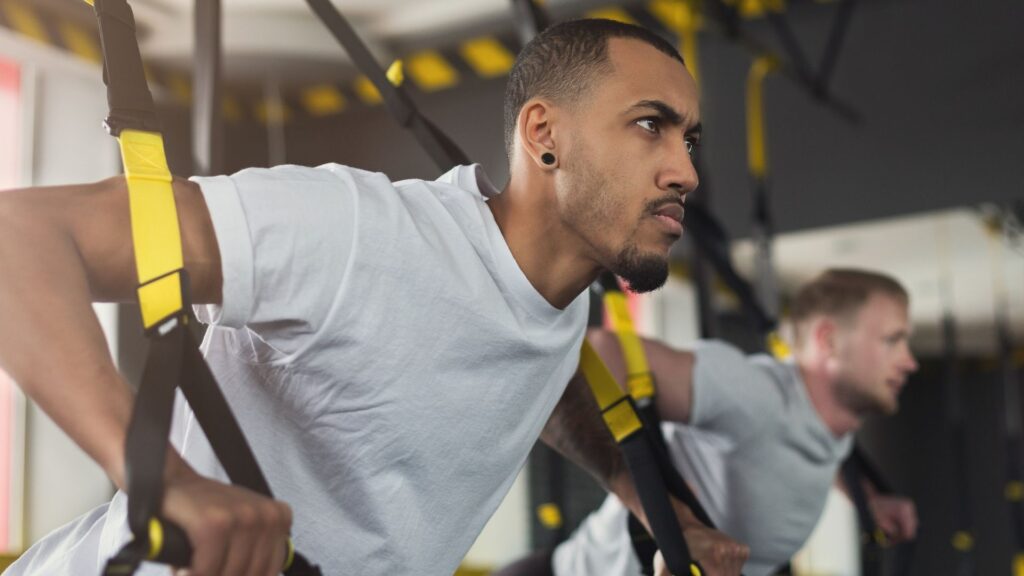 Two men competing in the CrossFit Games at their favorite gym.