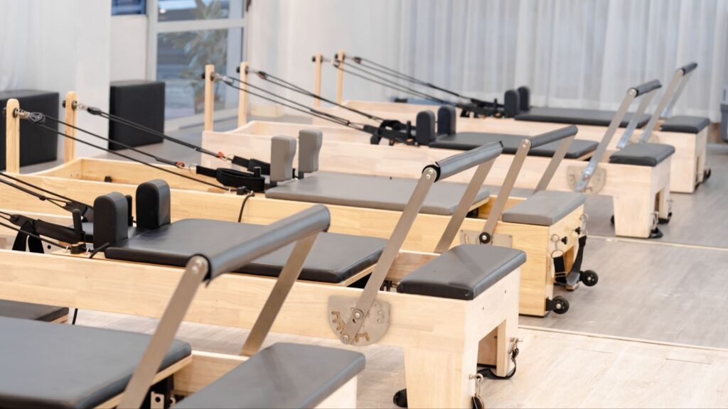 A neat and tidy row of Pilates machines at Sheine Pilates.