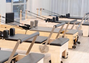 A neat and tidy row of Pilates machines at Sheine Pilates.