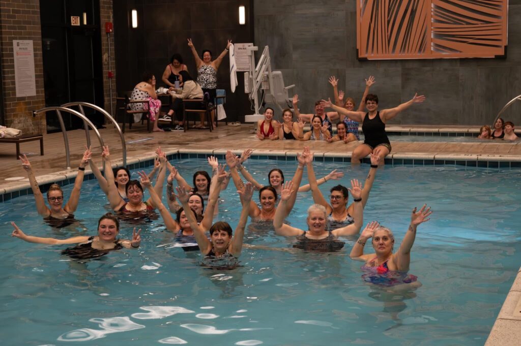 A pool packed full of happy Waves-N-Wellness customers.